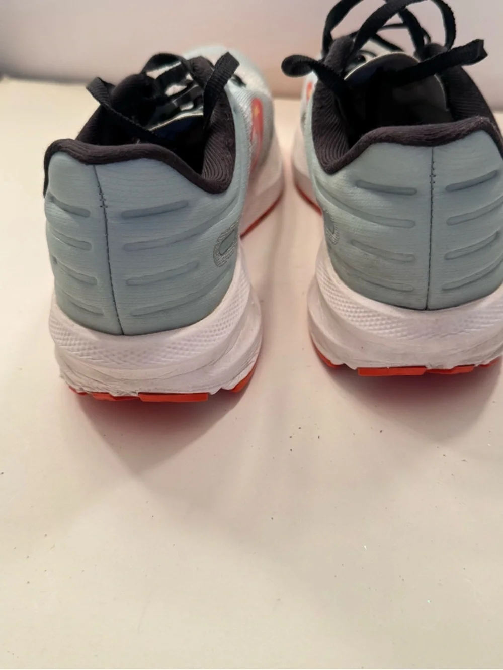 Brooks Light Gray Running Shoes with Red and Orange Accents
